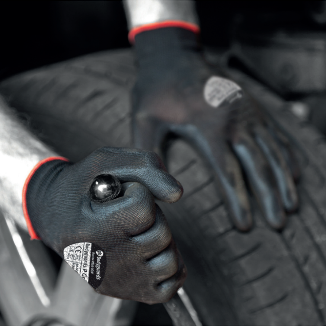 black pair of gloves in use